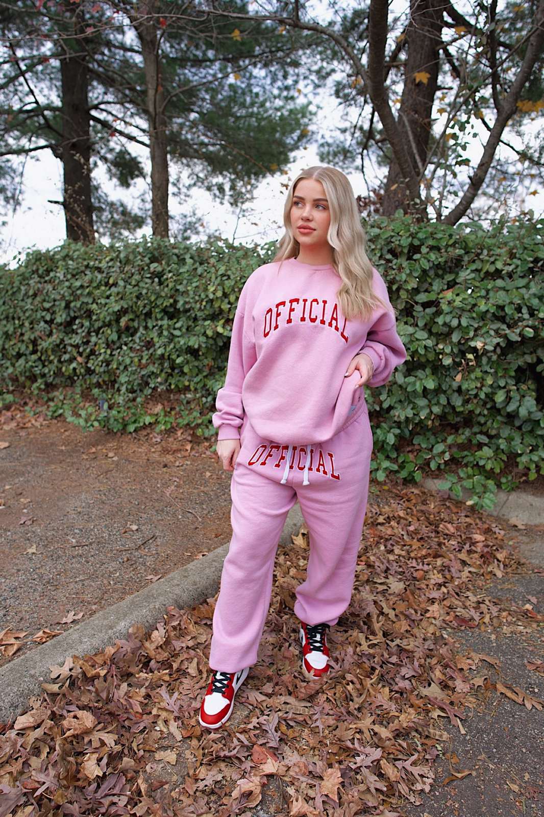 Erica McGee in a pink OFFICIAL sweatsuit